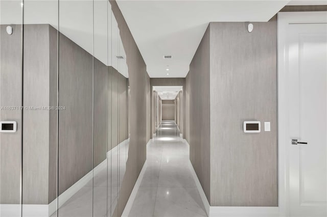 corridor with light tile patterned flooring