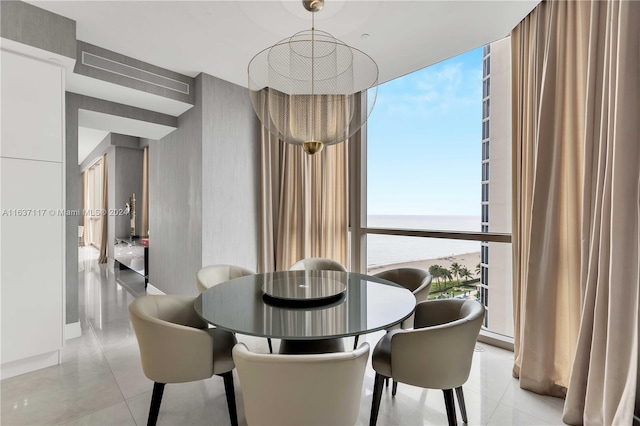 dining area featuring light tile patterned flooring, a wealth of natural light, and expansive windows