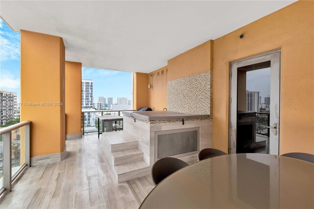 interior space featuring floor to ceiling windows and light hardwood / wood-style floors