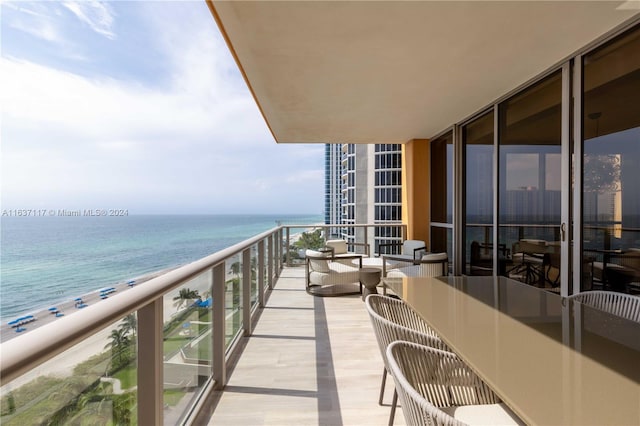 balcony featuring a water view