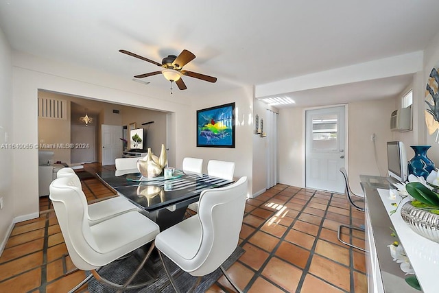 dining area featuring ceiling fan, tile patterned floors, and a wall mounted AC