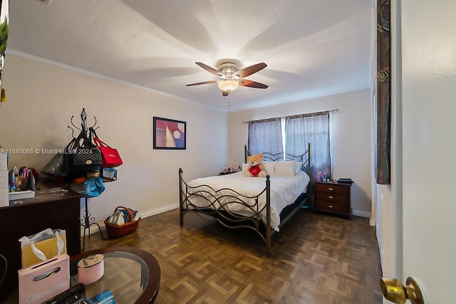 bedroom featuring ceiling fan, crown molding, and dark parquet flooring