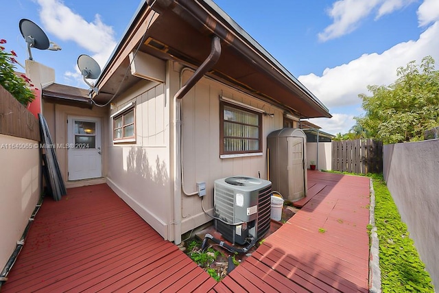 wooden deck with central air condition unit