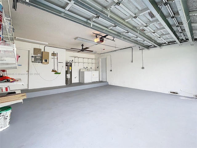 garage with electric water heater, a garage door opener, and separate washer and dryer