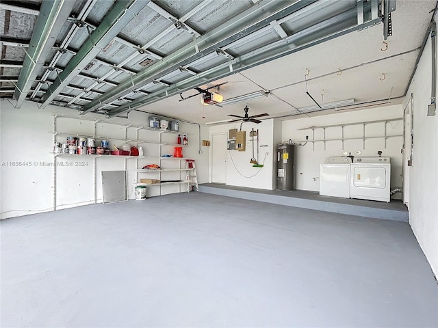 garage featuring a garage door opener, electric water heater, washing machine and dryer, and electric panel