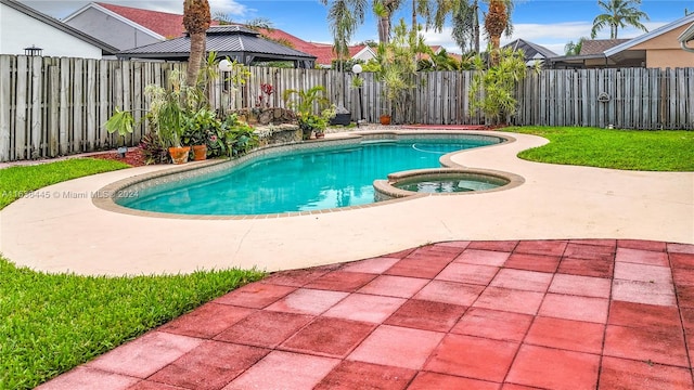 view of swimming pool featuring a patio area