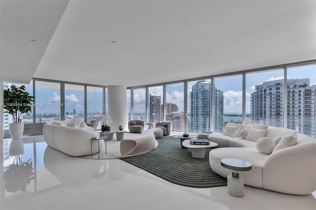 living room featuring a wealth of natural light and a wall of windows