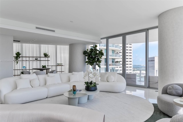 living room featuring floor to ceiling windows