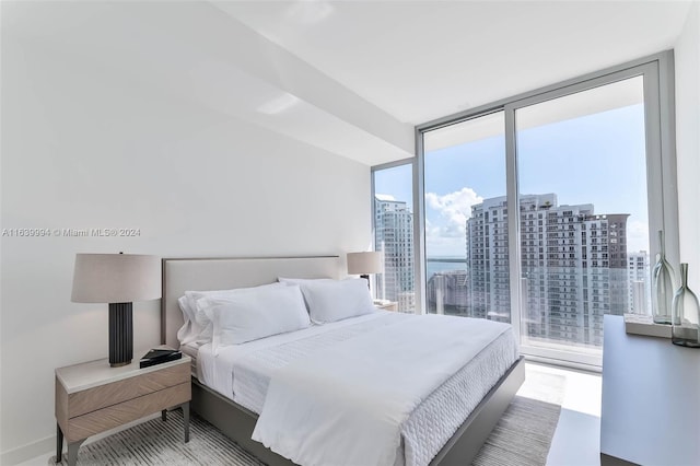 bedroom featuring a wall of windows