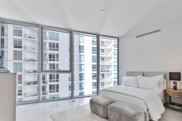 bedroom featuring floor to ceiling windows