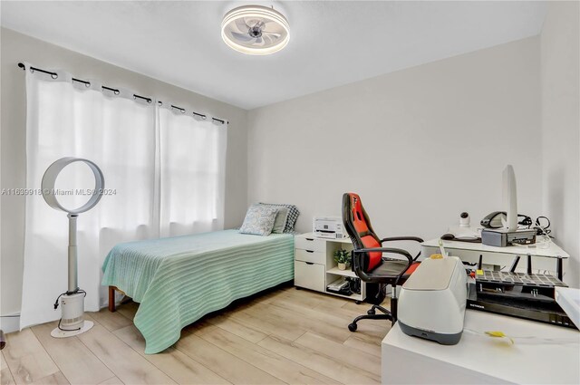 bedroom with light hardwood / wood-style flooring