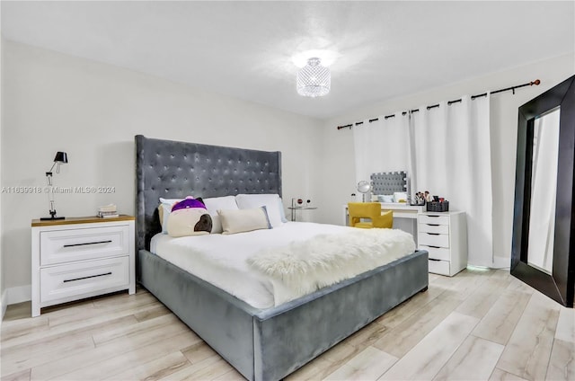 bedroom with light wood-type flooring