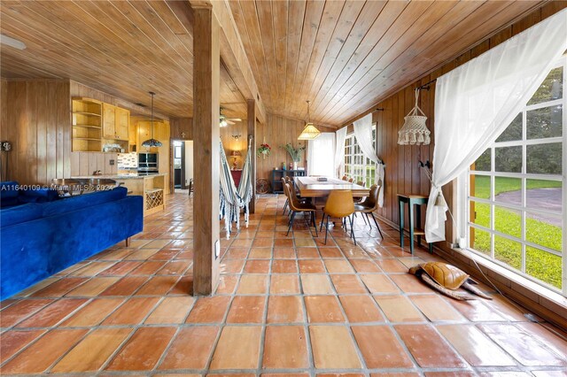 16255 SW 216th St, Miami, FL 33170 - dining area featuring wooden ceiling, wooden walls, vaulted ceiling, and tile patterned flooring