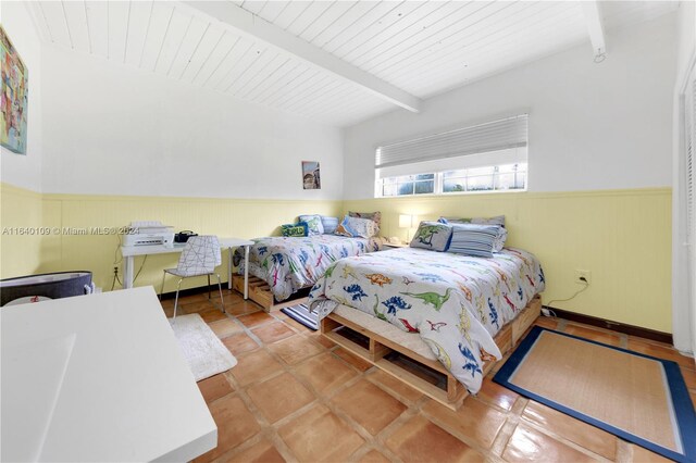 16255 SW 216th St, Miami, FL 33170 - tiled bedroom featuring a wainscoted wall, wood ceiling with exposed beams, and wood walls