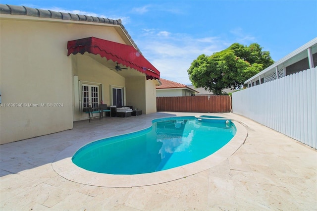 view of swimming pool with a patio area, a fenced backyard, and a fenced in pool