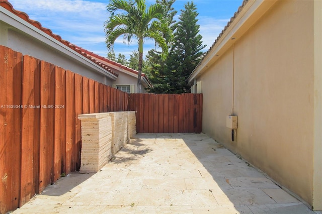 view of patio featuring fence