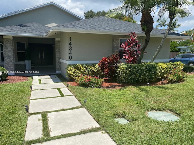 view of front of home with a front lawn