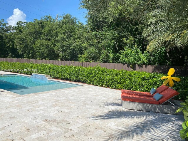 view of pool featuring a patio