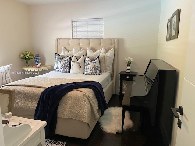 bedroom with hardwood / wood-style floors