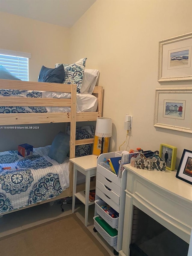 bedroom featuring carpet