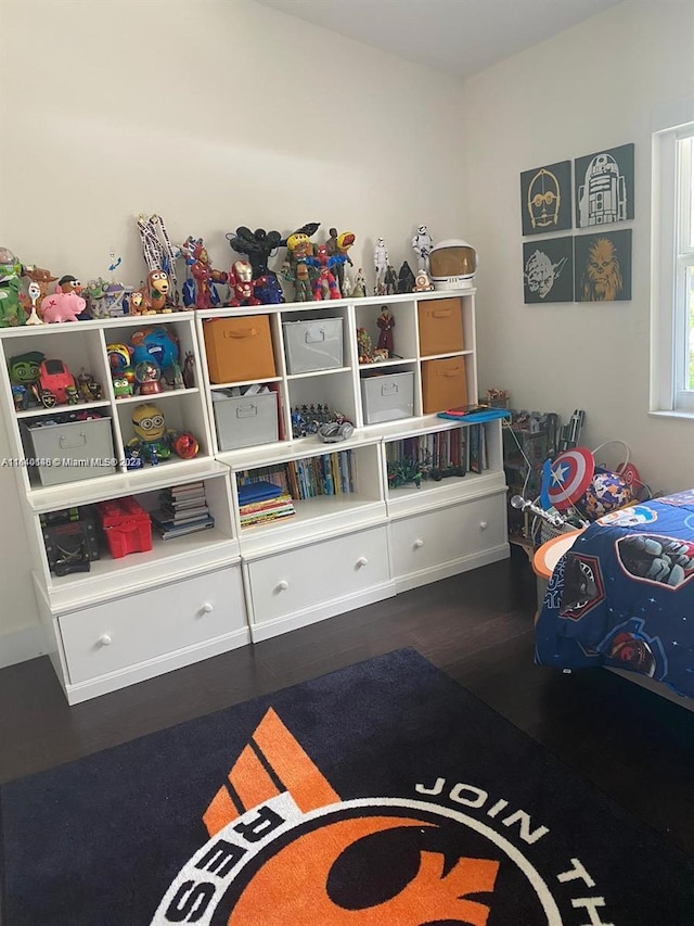 game room with dark hardwood / wood-style flooring