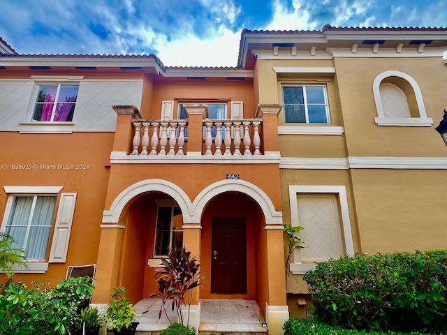 doorway to property featuring a balcony