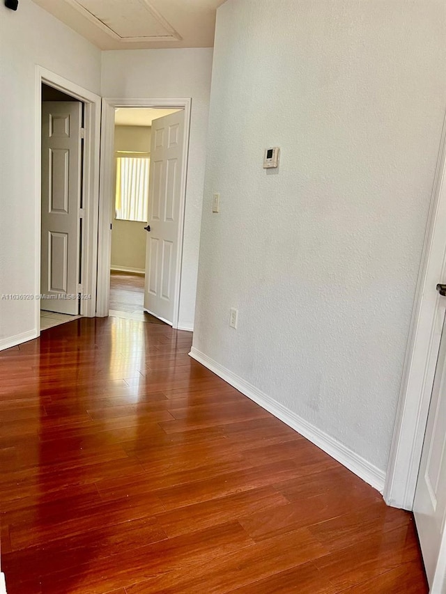 spare room with hardwood / wood-style floors