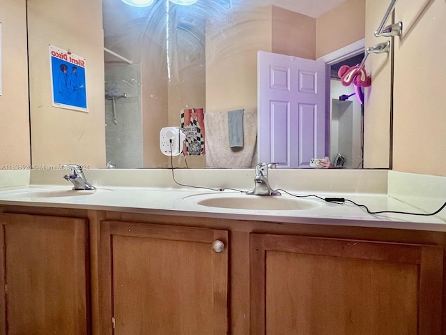 bathroom with a shower and vanity