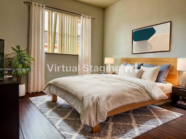 bedroom featuring dark hardwood / wood-style flooring