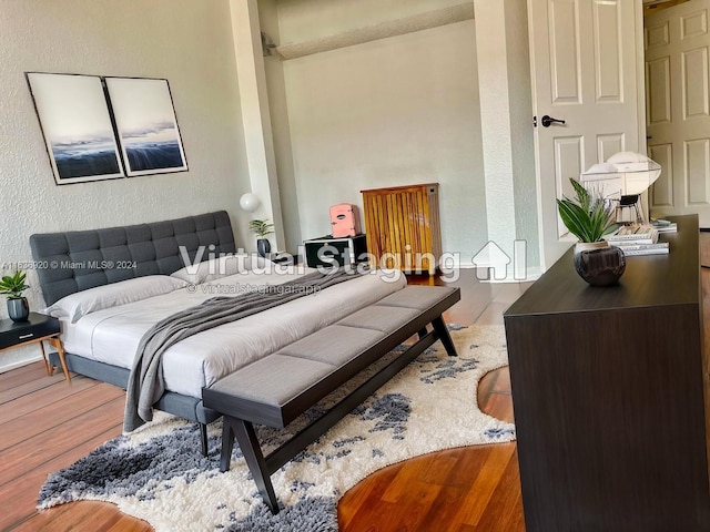 bedroom with wood-type flooring