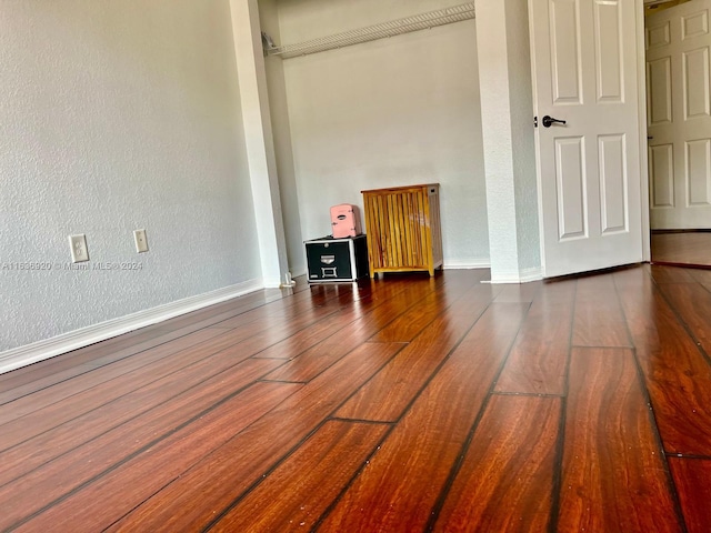 empty room featuring dark hardwood / wood-style floors