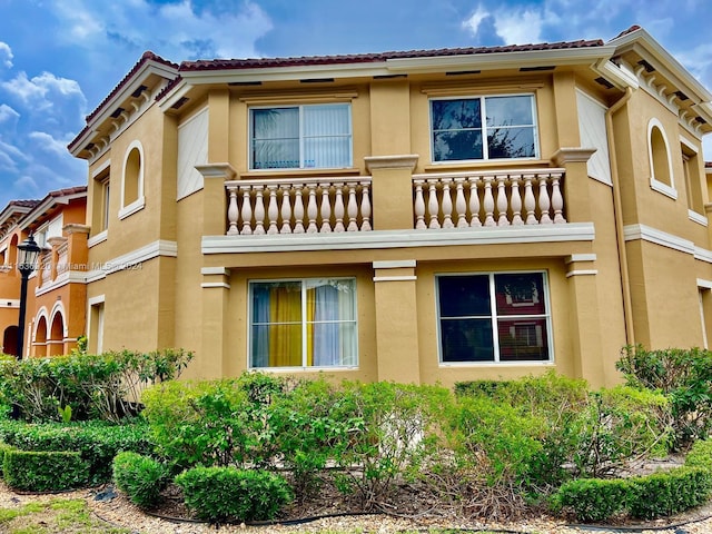 view of home's exterior featuring a balcony