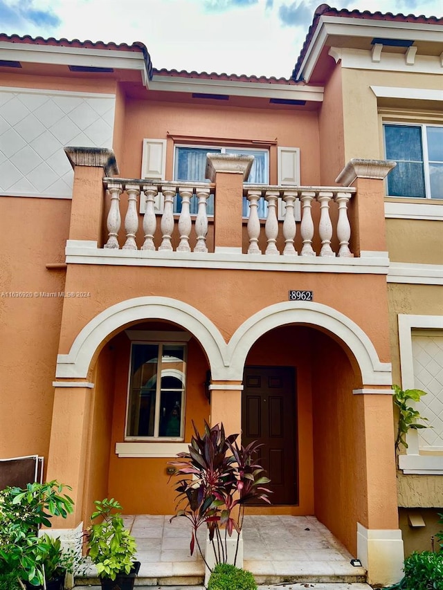 doorway to property with a balcony