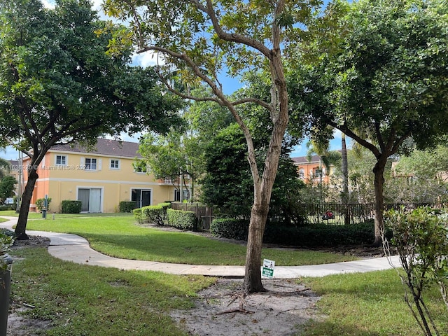 view of home's community with a lawn