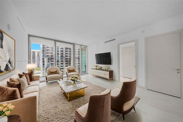 living room featuring a wall of windows