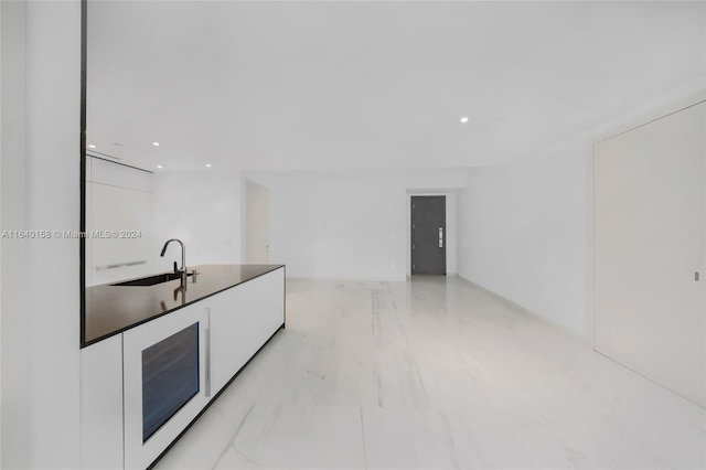 300 Biscayne Blvd Way Unit 2009, Miami, FL 33131 - kitchen with a sink, modern cabinets, marble finish floor, white cabinets, and recessed lighting