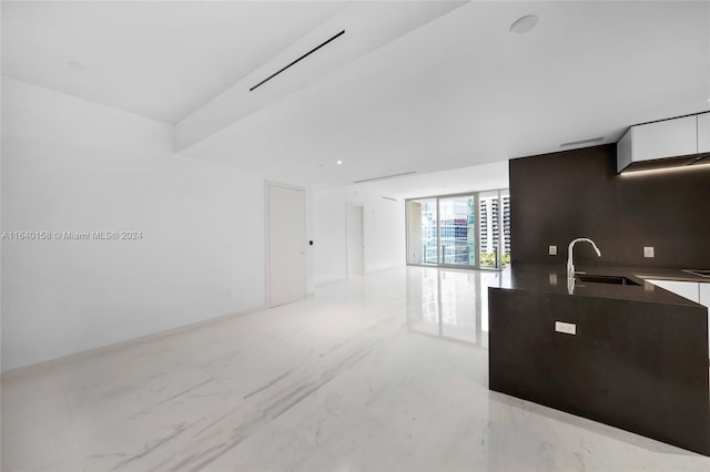 300 Biscayne Blvd Way Unit 2009, Miami, FL 33131 - kitchen with open floor plan, marble finish floor, a sink, and white cabinetry