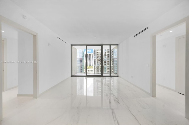 300 Biscayne Blvd Way Unit 2009, Miami, FL 33131 - spare room featuring expansive windows, visible vents, and marble finish floor