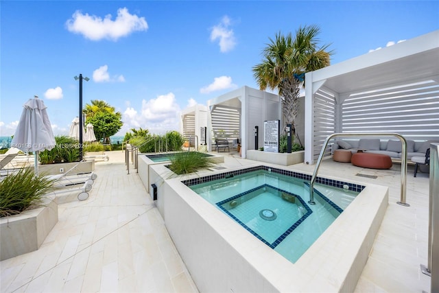 view of swimming pool featuring a pergola, a hot tub, outdoor lounge area, and a patio area