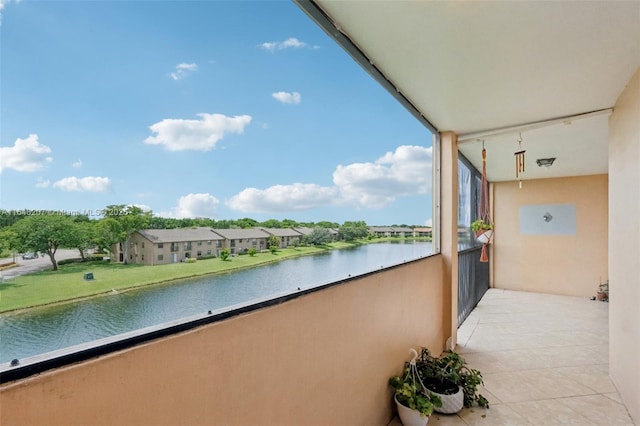 balcony featuring a water view