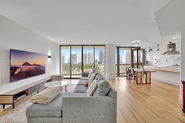 living room featuring light hardwood / wood-style flooring and expansive windows