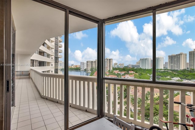 unfurnished sunroom with a water view