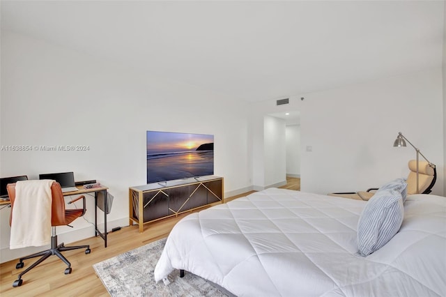 bedroom with light hardwood / wood-style flooring