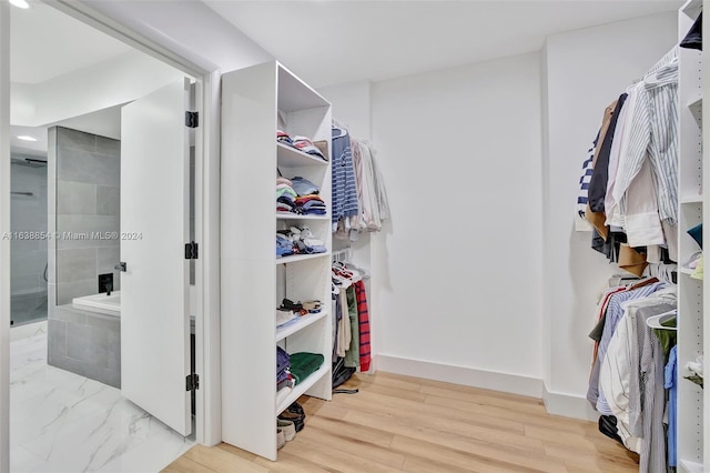 walk in closet featuring light wood-type flooring