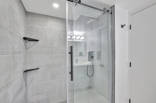 bathroom with a shower with shower door