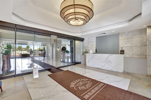 reception area with a notable chandelier