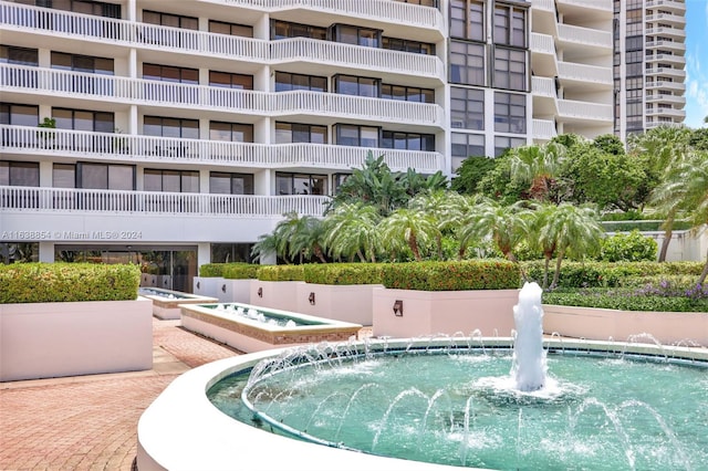 view of pool with pool water feature