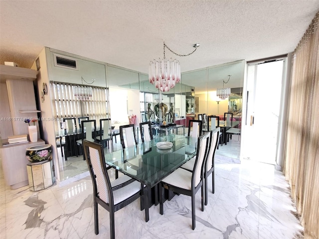 dining space featuring light tile patterned flooring, a chandelier, and plenty of natural light