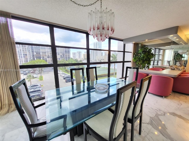 dining area with expansive windows, a textured ceiling, and an inviting chandelier