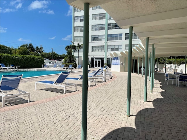 view of swimming pool featuring a patio area